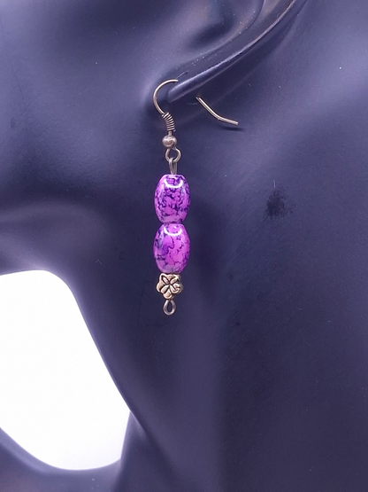 Brass-tone antiqued bookmark with purple marbled bead and translucent heart charm, and earrings