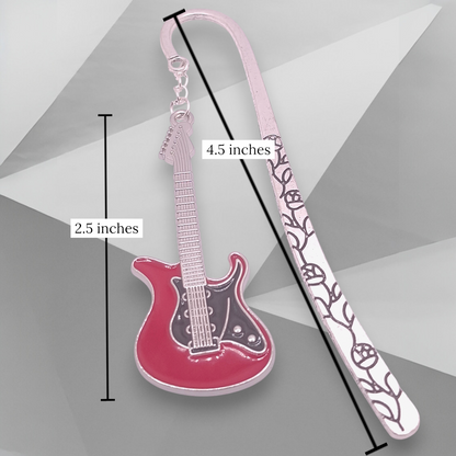 Red and black electric guitar on a floral-patterned bookmark on a gray background.  